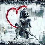 Street art Cupid with a gun painting a love heart - License,